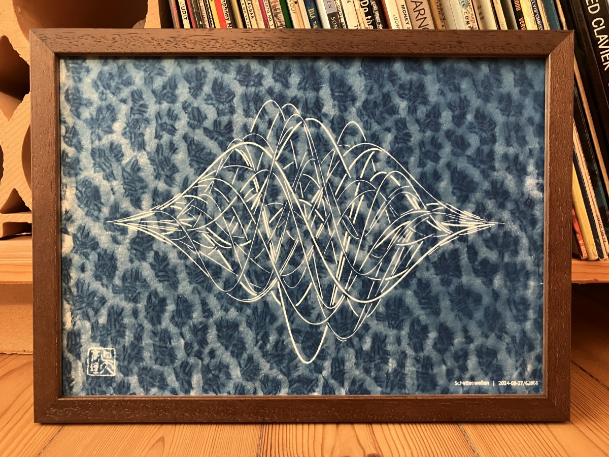 Framed cyanotype print of generative wavy lines, with an interesting texture in the blue background.